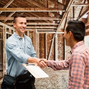 Carpenter shaking hand with customer